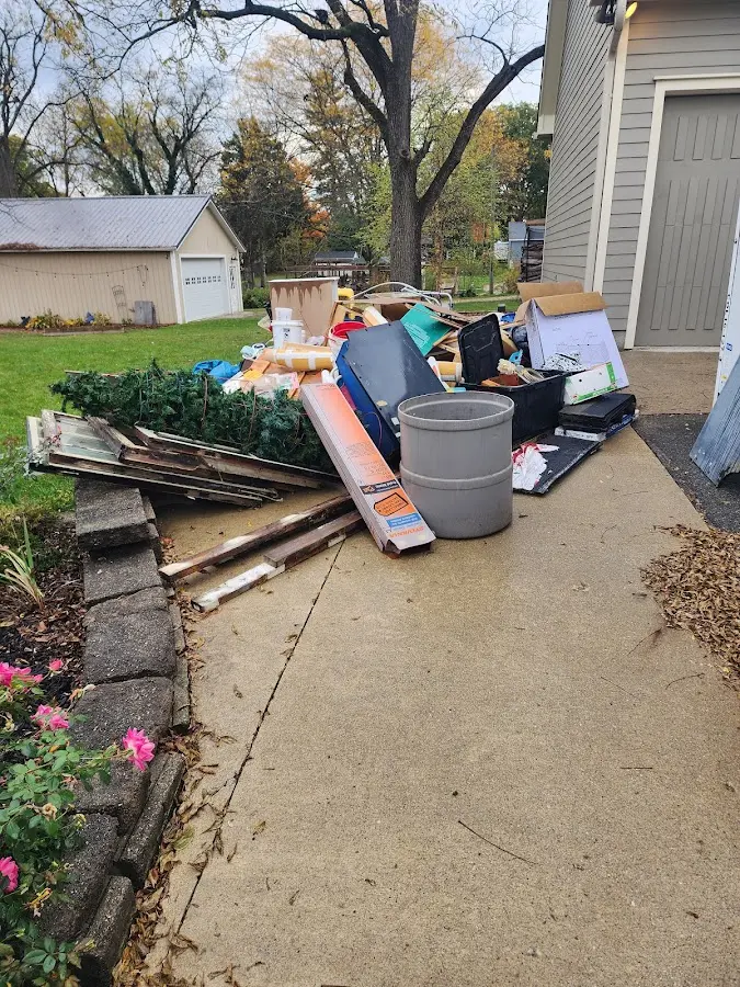Dumpster being loaded with debris for Estate Cleanout Dumpster Rental in Little Egg Harbor